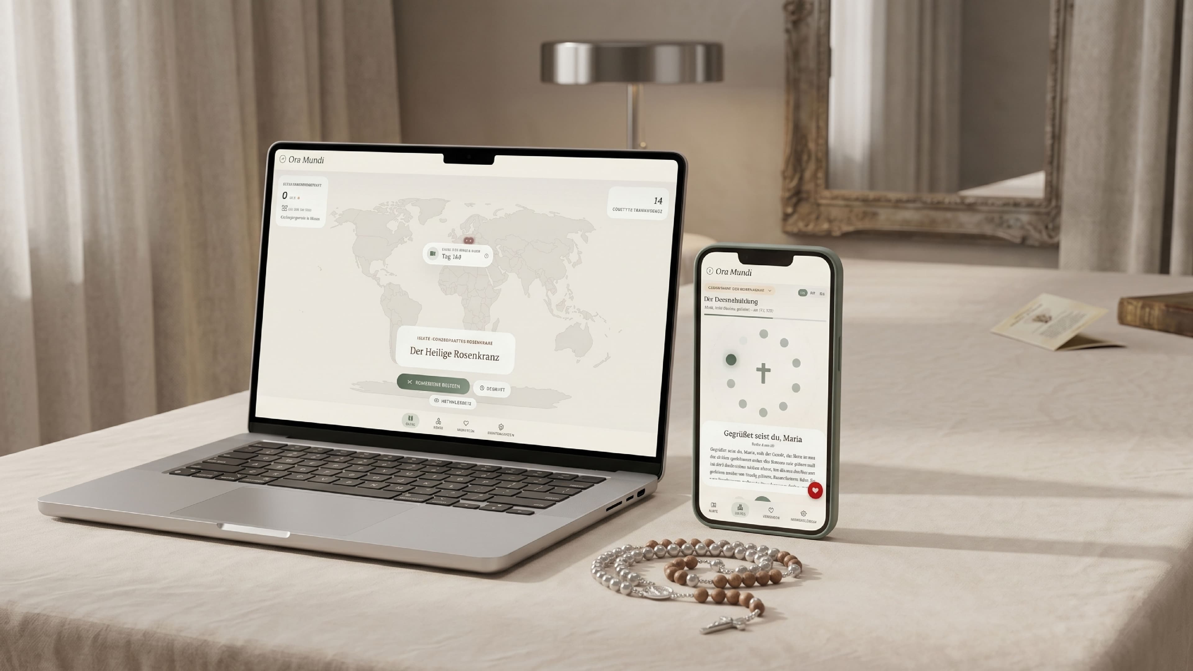 Ora Mundi auf MacBook und iPhone mit Rosenkranz daneben